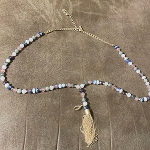 Beaded necklace with tassel.